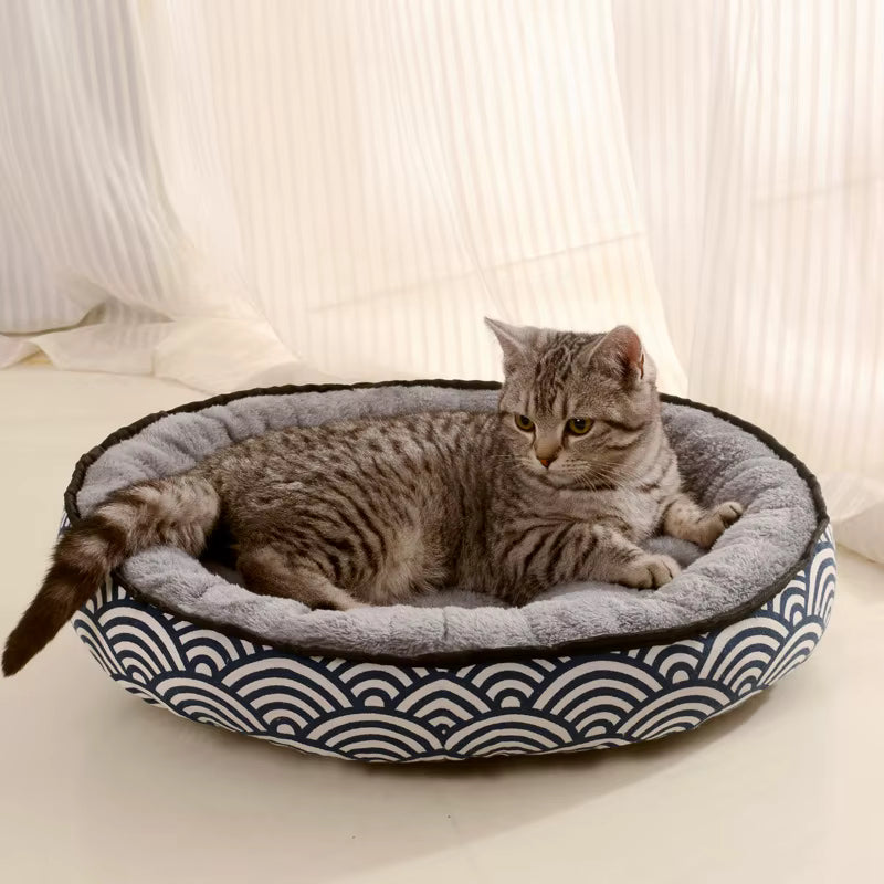 Small round kitten bed with plush velvet interior
