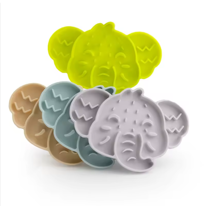 Stack of elephant-shaped silicone slow feeder mats in assorted colours
