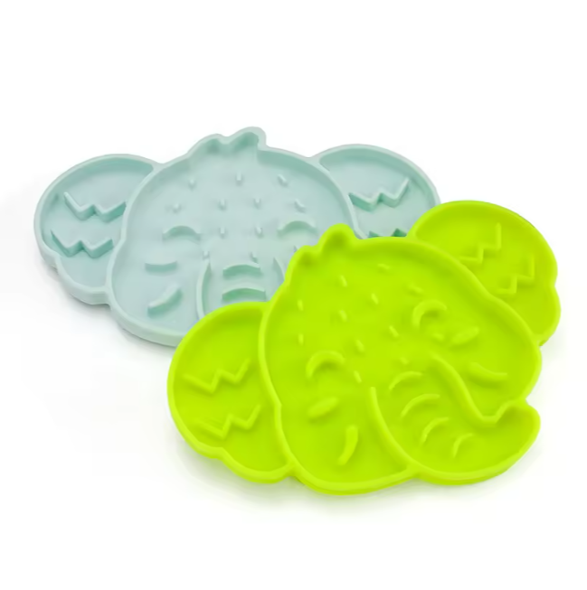 Stack of elephant-shaped silicone slow feeder mats in assorted colours