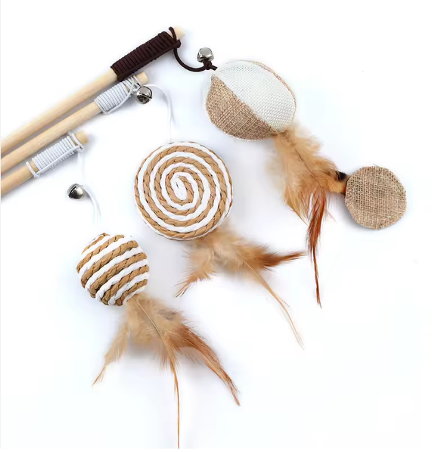 set of wooden cat wands with feather and jute attachments