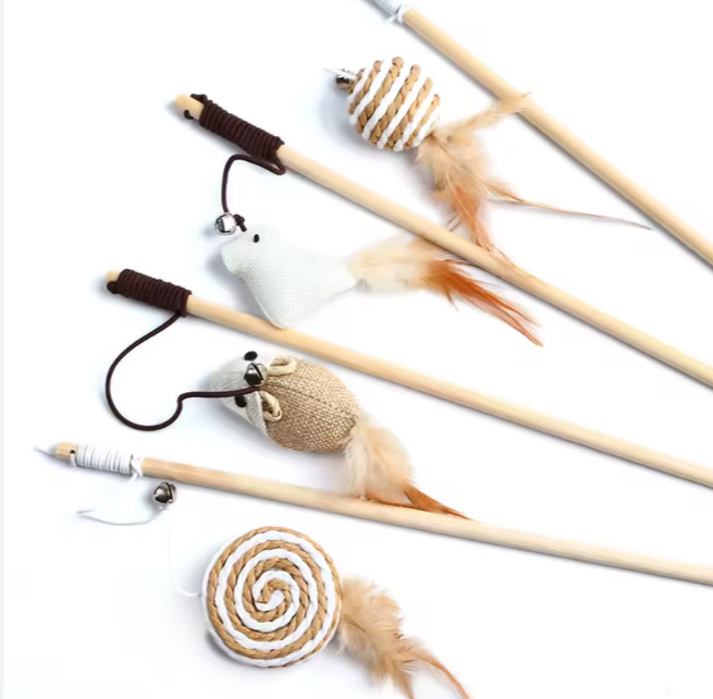 set of wooden cat wands with feather and jute attachments