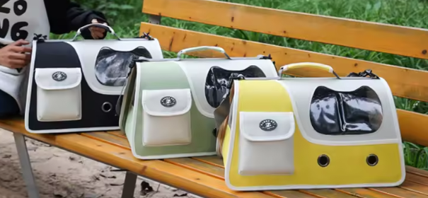 Multiple foldable cat carriers in black, green, and yellow