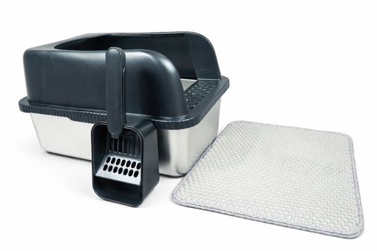 A stainless steel cat litter box with high walls, scoop and litter mat for apartment living. 