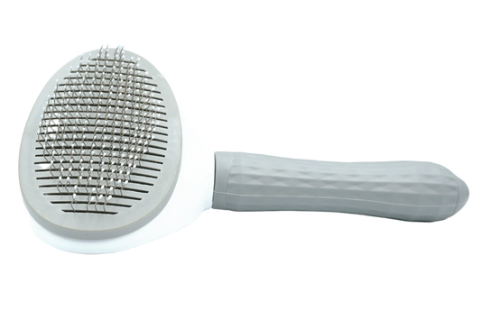 Self-cleaning cat grooming brush – The Cleaner. Steel bristle slicker brush for cats – The Apartment Cat. 